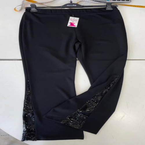 Pantalone modello zampa con intaglio pizzo rebrodè effetto crepè